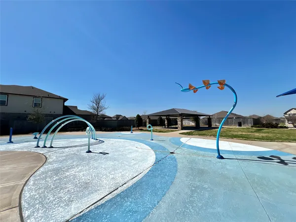 a view of a swimming pool with a yard