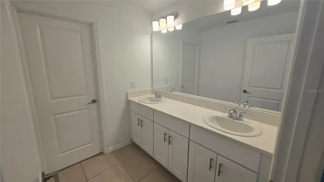 a white toilet sitting next to a bath tub