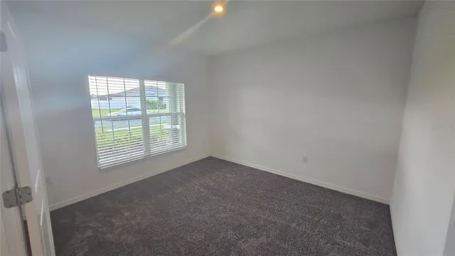 a view of a big room with windows