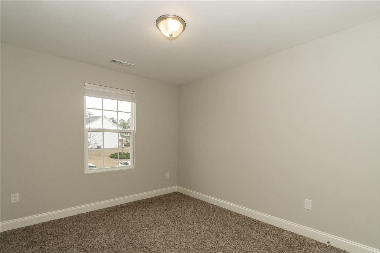 3934 Volkswalk Place Raleigh, NC 27610 - Photo 11 of 16 an empty room with a window