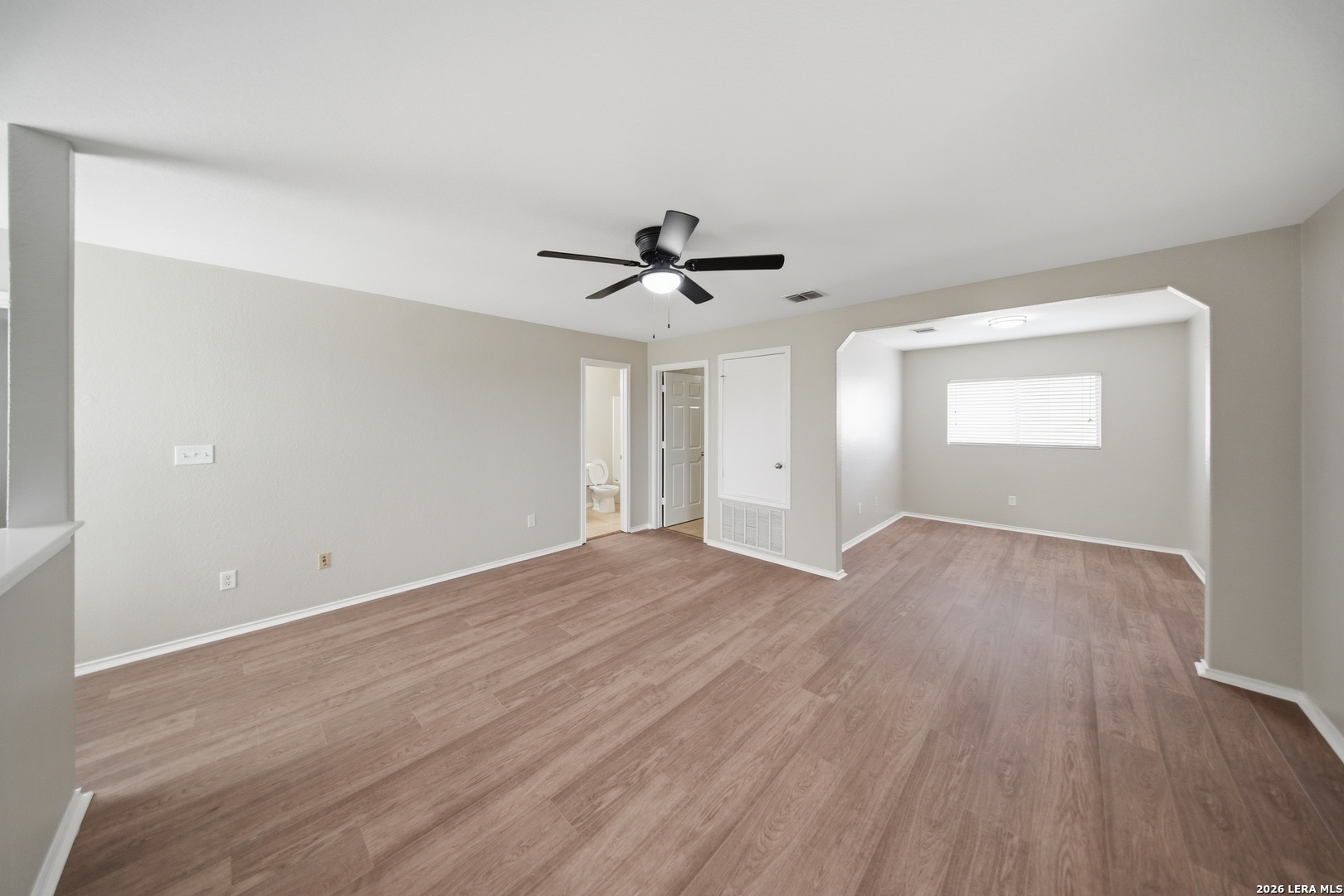 403 Walnut Crest Schertz, TX 78154 - Photo 16 of 30 a view of empty room with wooden floor and fan