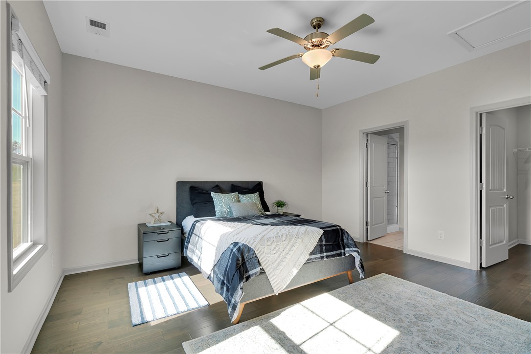 302 Phillips Drive Pendleton, SC 29670 - Photo 11 of 27 This bright and airy bedroom features rich hardwood flooring and abundant natural light.