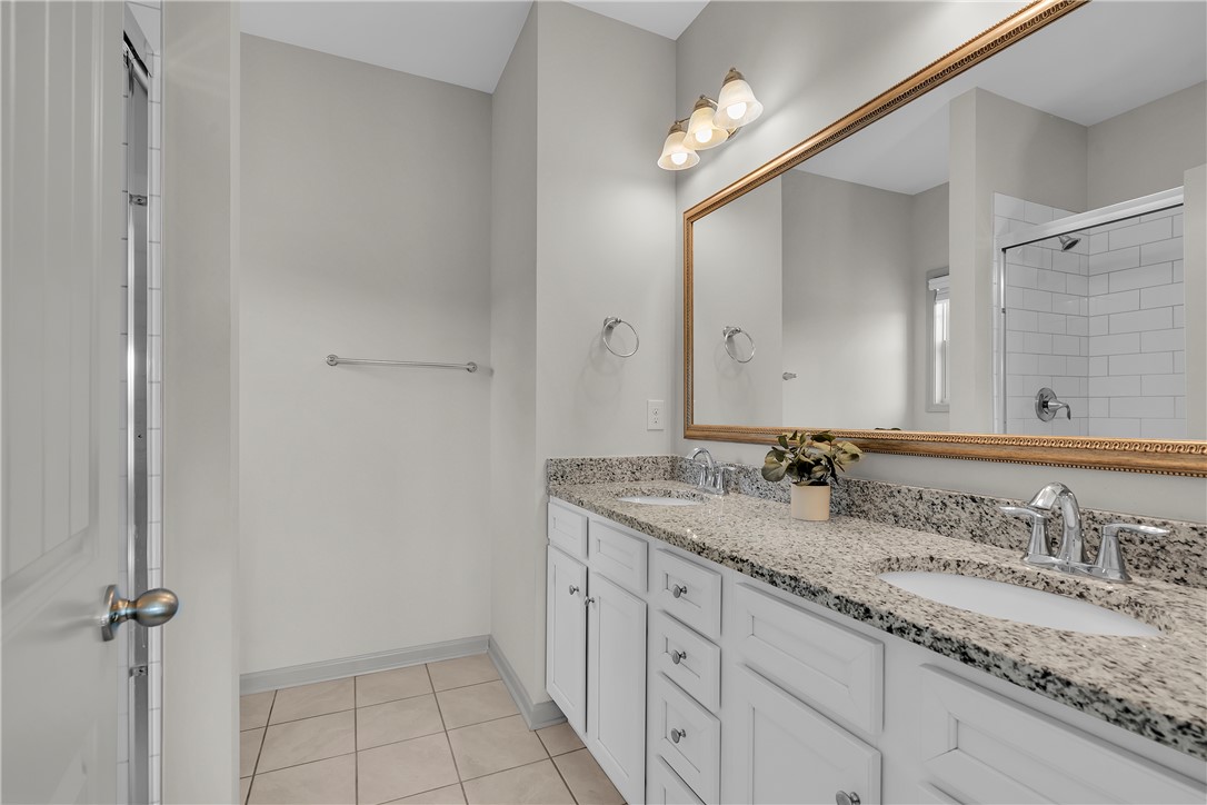 302 Phillips Drive Pendleton, SC 29670 - Photo 12 of 27 This bright bathroom features a spacious double vanity with ample counter space and a modern shower.
