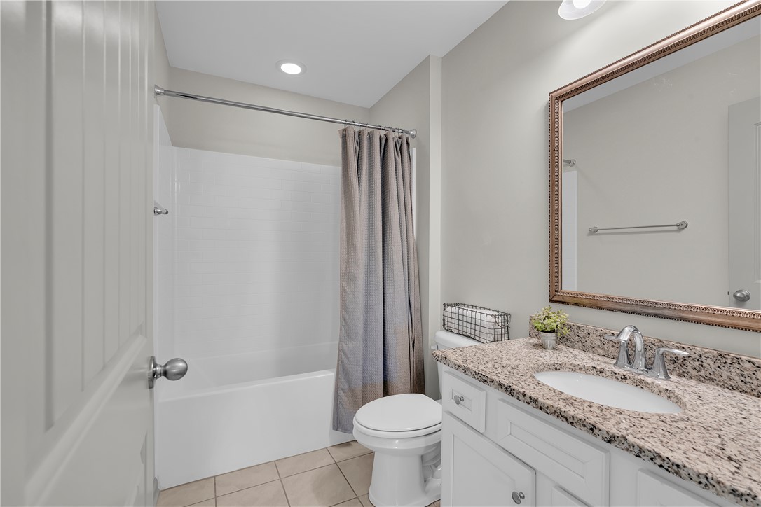 302 Phillips Drive Pendleton, SC 29670 - Photo 19 of 27 This clean and inviting bathroom features a spacious vanity with ample storage and a classic shower-tub combination.