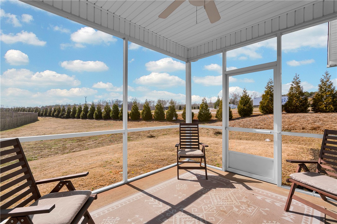302 Phillips Drive Pendleton, SC 29670 - Photo 22 of 27 Relax and enjoy serene outdoor living on this screened porch, perfect for any season.