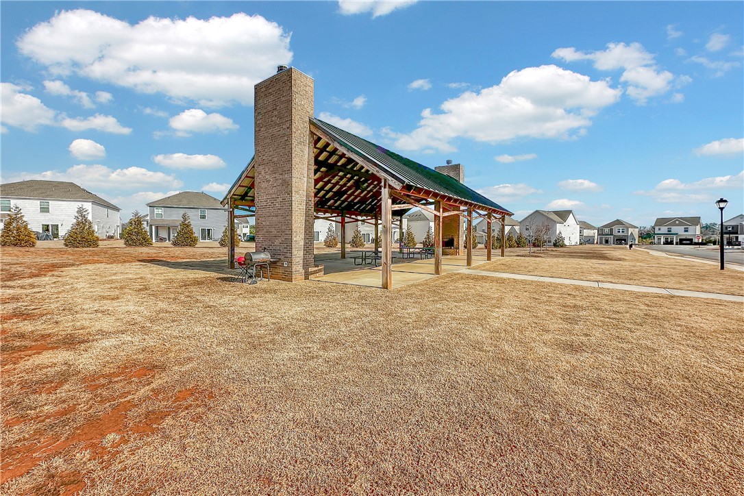 302 Phillips Drive Pendleton, SC 29670 - Photo 24 of 27 An inviting pavilion with a fireplace and brick chimney provides a comfortable community gathering space.