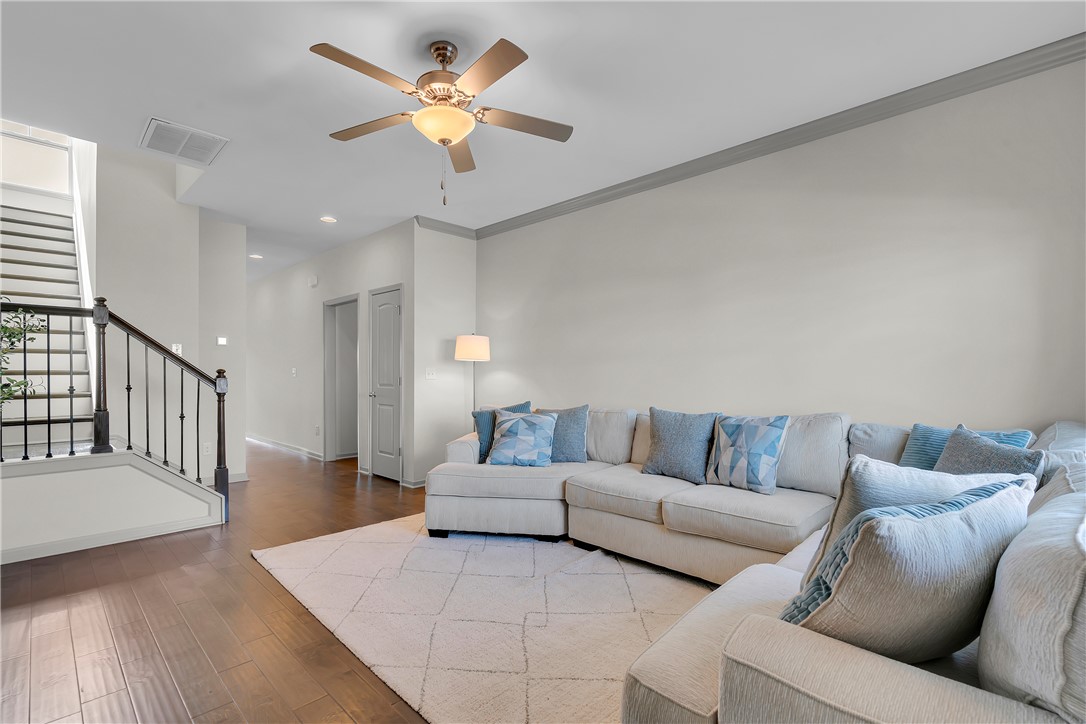 302 Phillips Drive Pendleton, SC 29670 - Photo 3 of 27 This living room features gleaming hardwood floors and a striking staircase.