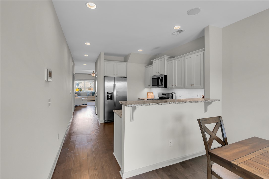 302 Phillips Drive Pendleton, SC 29670 - Photo 6 of 27 This open concept kitchen and living area feature recessed lighting and rich hardwood flooring.