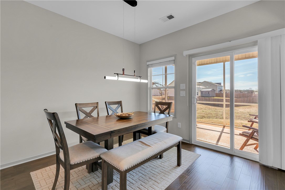 302 Phillips Drive Pendleton, SC 29670 - Photo 9 of 27 This bright dining area features ample natural light and a seamless connection to the outdoor patio.