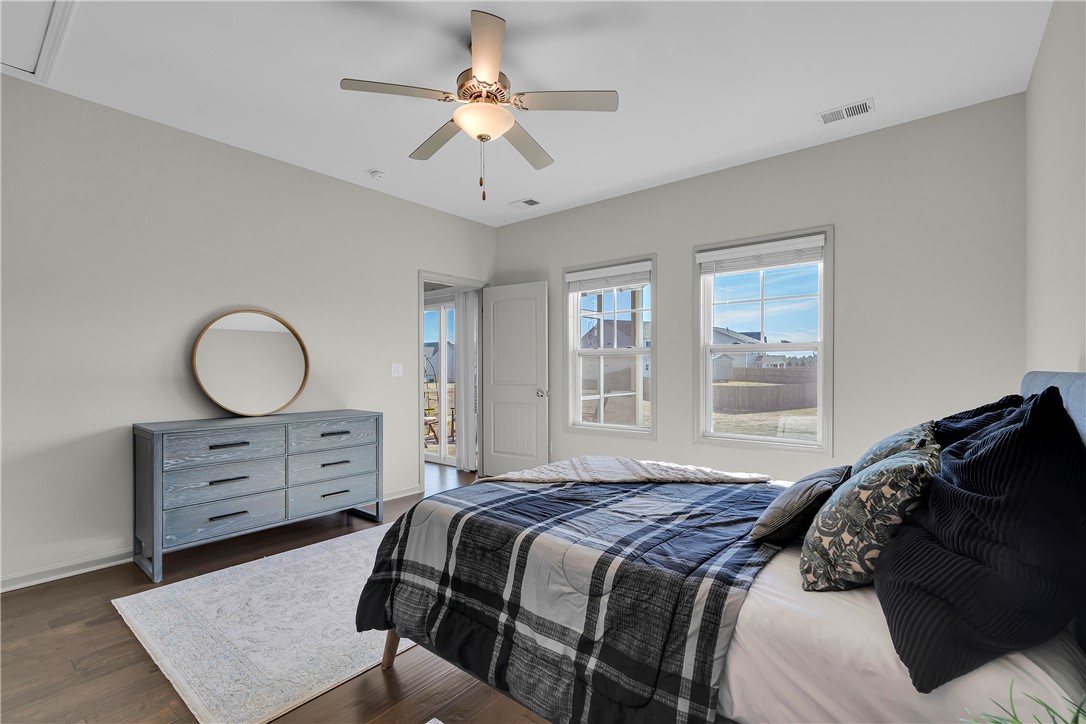 302 Phillips Drive Pendleton, SC 29670 - Photo 10 of 27 This spacious bedroom offers ample natural light and direct outdoor access.