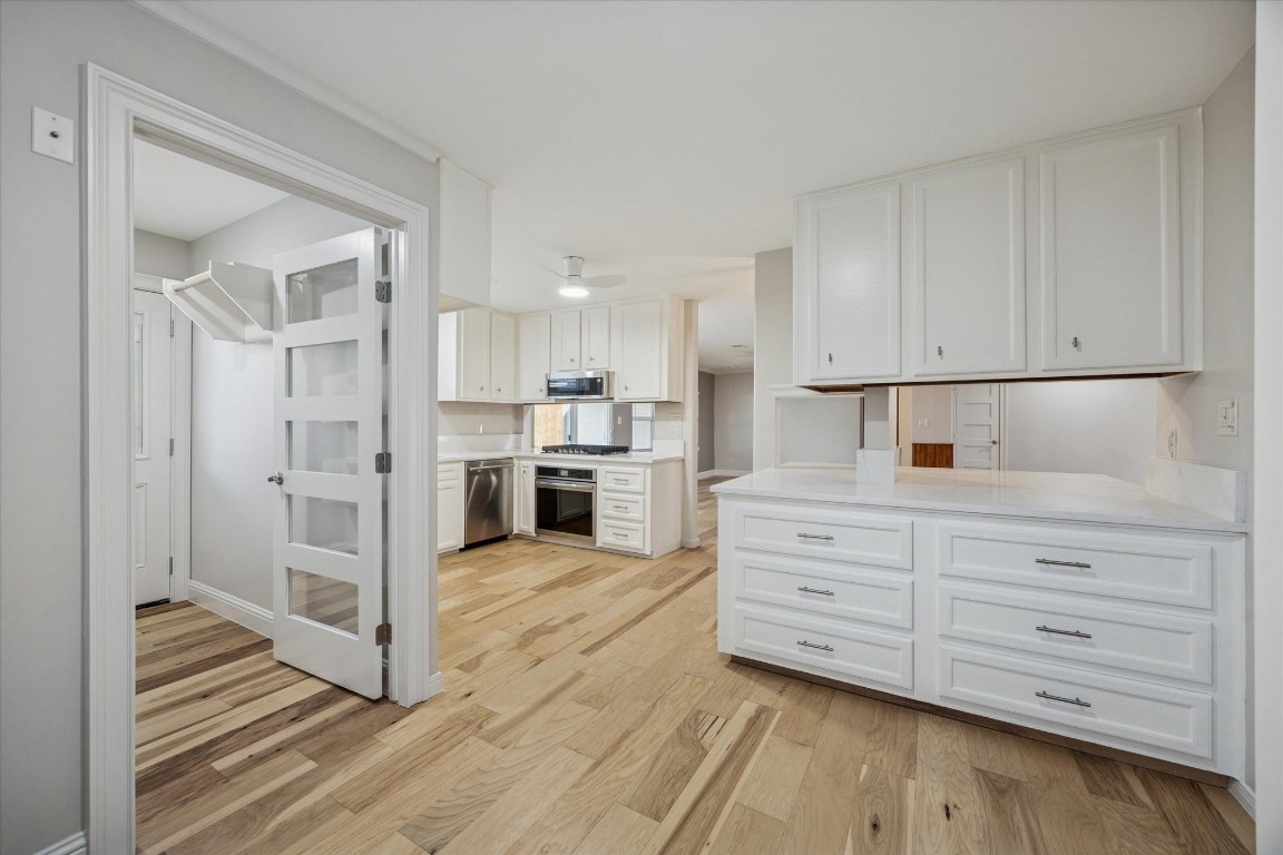 10422 Raritan Drive Houston, TX 77043 - Photo 11 of 31 a kitchen with stainless steel appliances cabinets and a window
