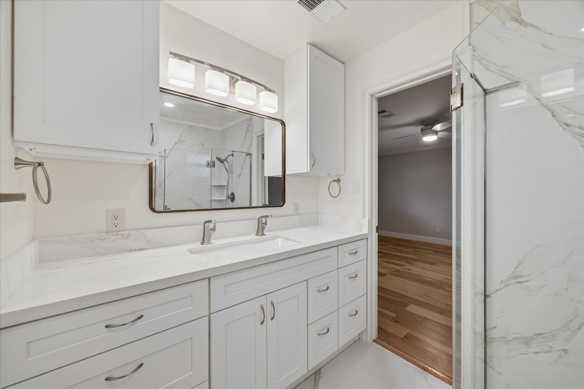 10422 Raritan Drive Houston, TX 77043 - Photo 15 of 31 a bathroom with a double vanity sink mirror and