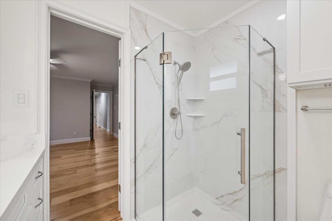 10422 Raritan Drive Houston, TX 77043 - Photo 16 of 31 a bathroom with a shower and a glass door