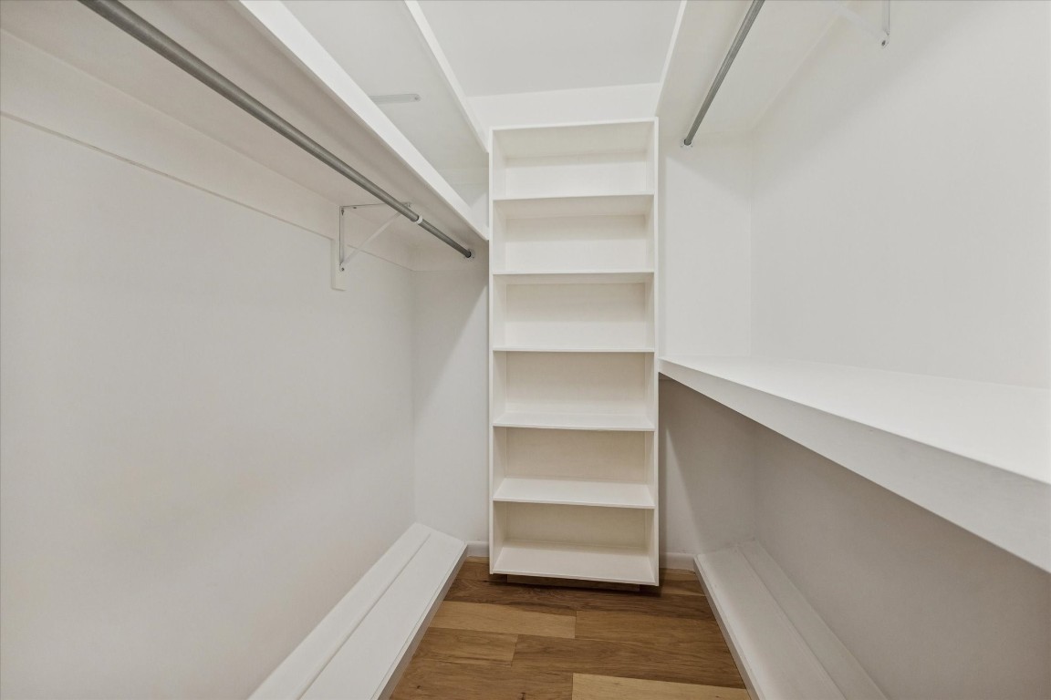 10422 Raritan Drive Houston, TX 77043 - Photo 17 of 31 a view of walk in closet with empty racks