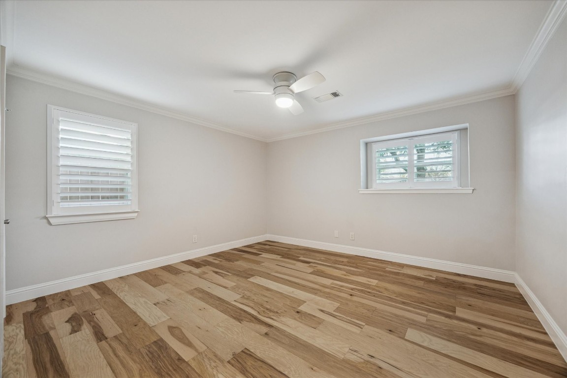 10422 Raritan Drive Houston, TX 77043 - Photo 20 of 31 a view of empty room with wooden floor