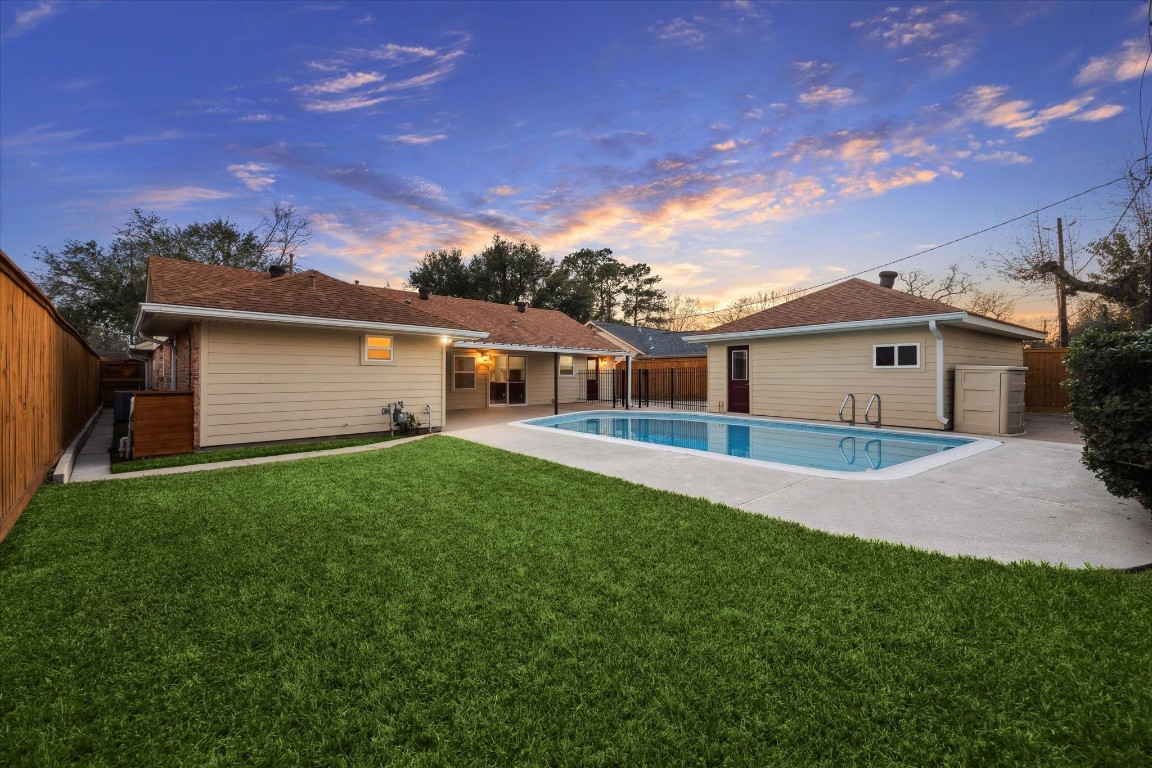 10422 Raritan Drive Houston, TX 77043 - Photo 24 of 31 a front view of a house with a garden