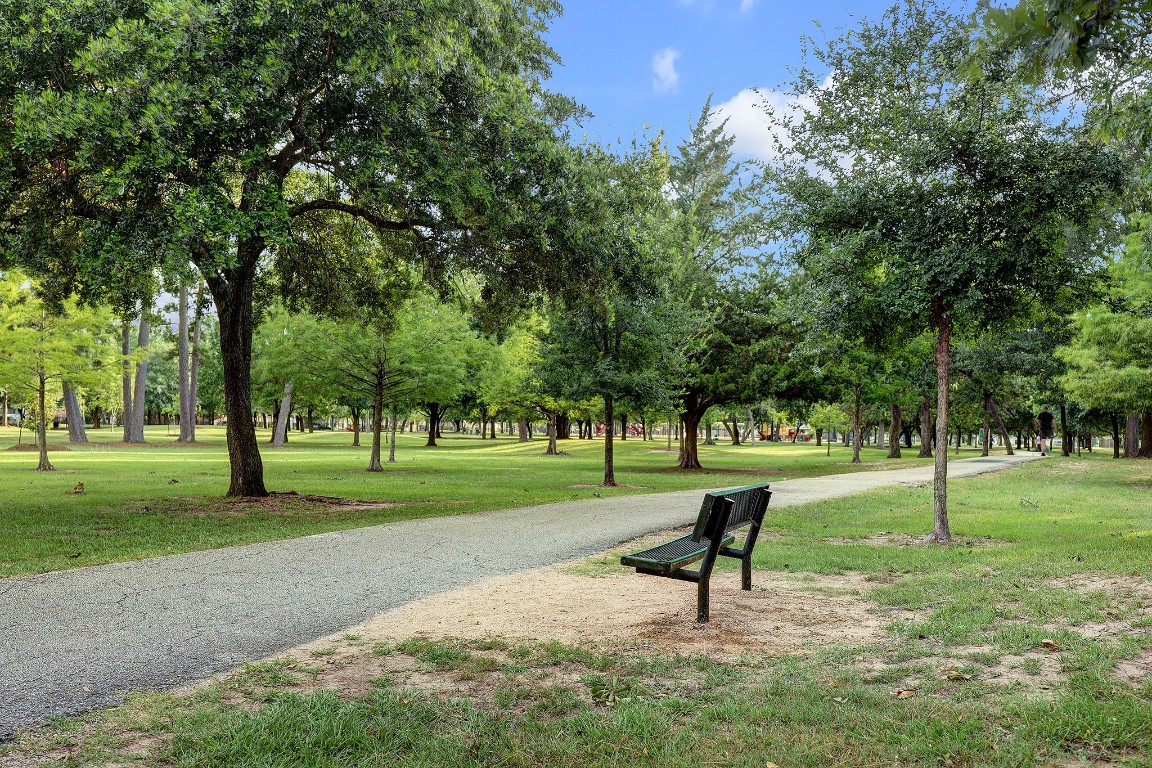 10422 Raritan Drive Houston, TX 77043 - Photo 26 of 31 a park view with a bench in a park
