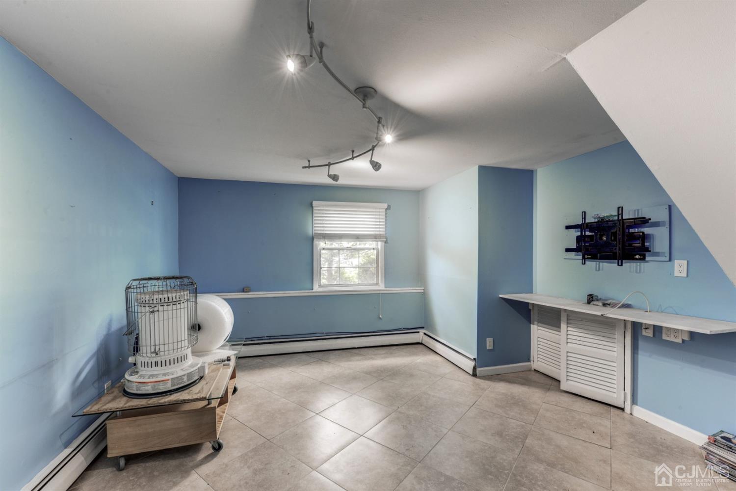 37 Finley Road Edison, NJ 08817 - Photo 15 of 29 a room with furniture and window