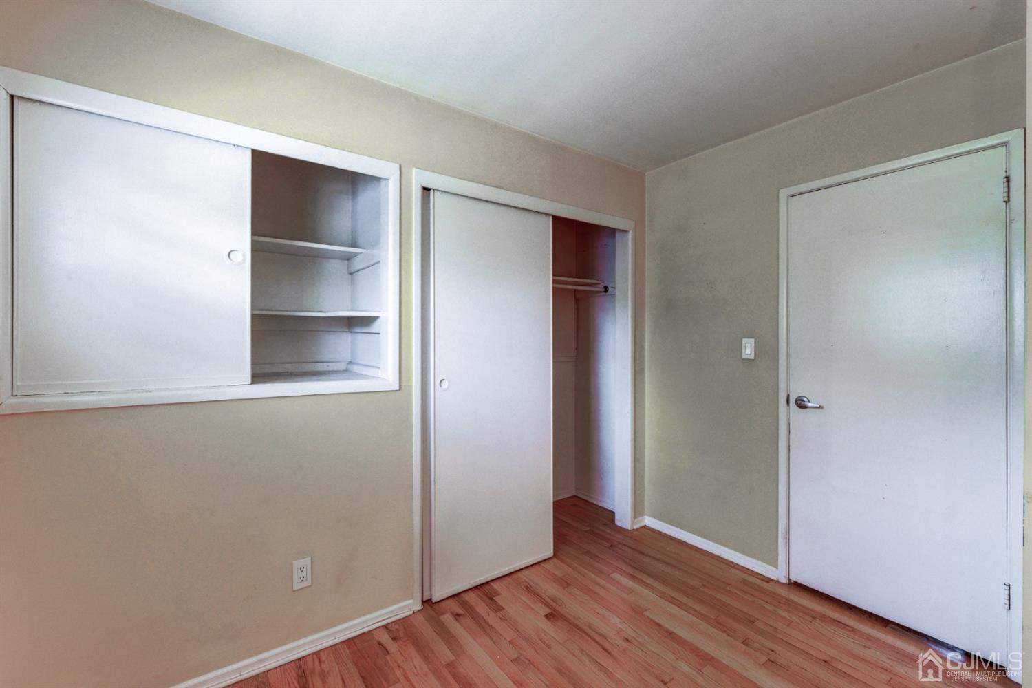 37 Finley Road Edison, NJ 08817 - Photo 18 of 29 a view of an empty room with wooden floor and closet