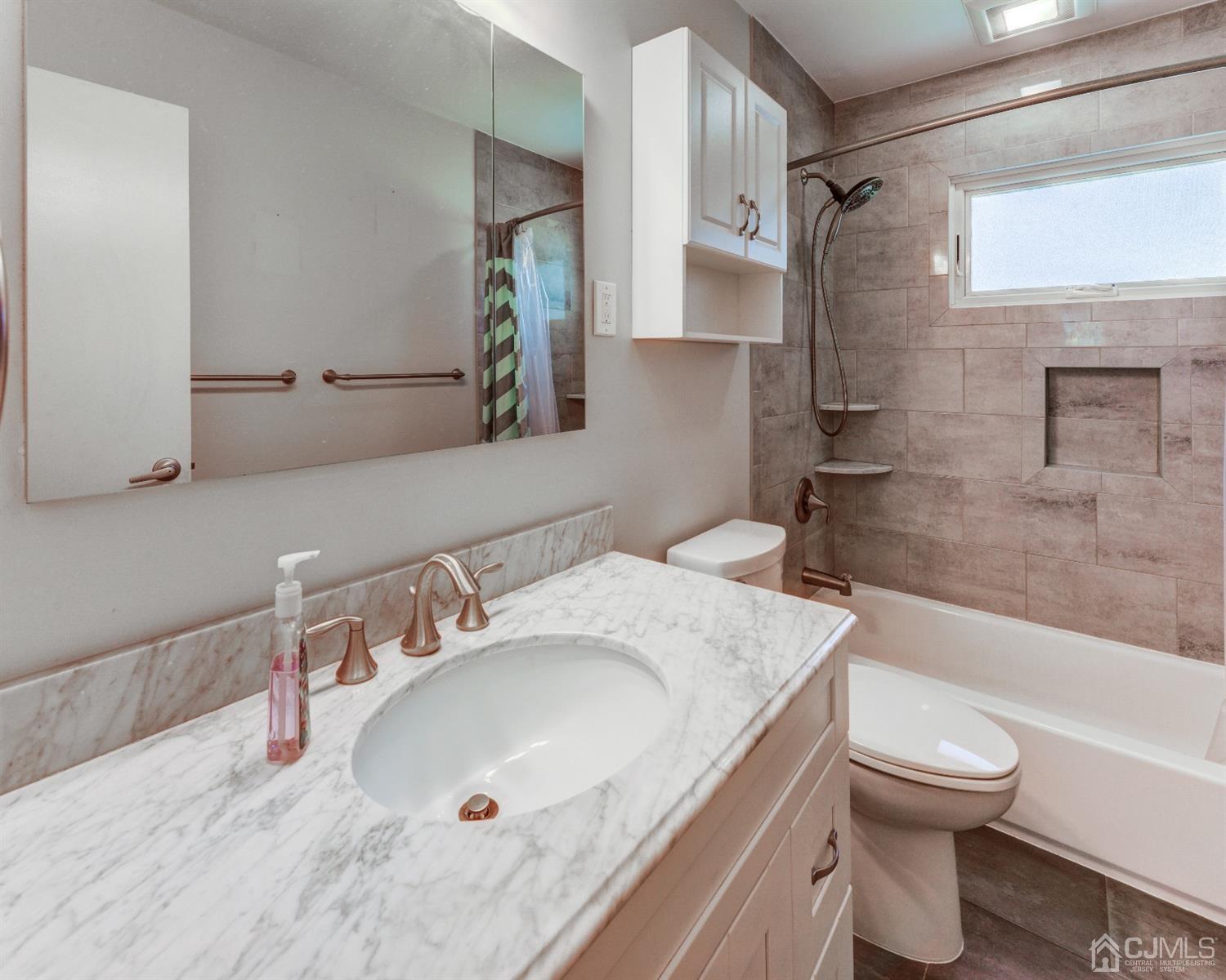 37 Finley Road Edison, NJ 08817 - Photo 23 of 29 a bathroom with a granite countertop sink toilet and shower
