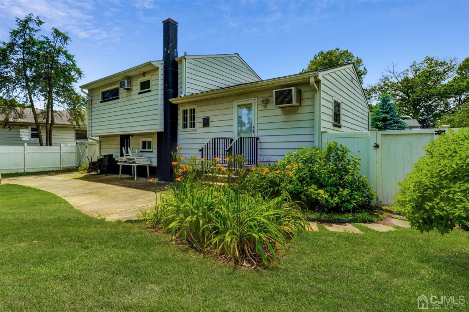 37 Finley Road Edison, NJ 08817 - Photo 29 of 29 a front view of a house with a yard and outdoor seating