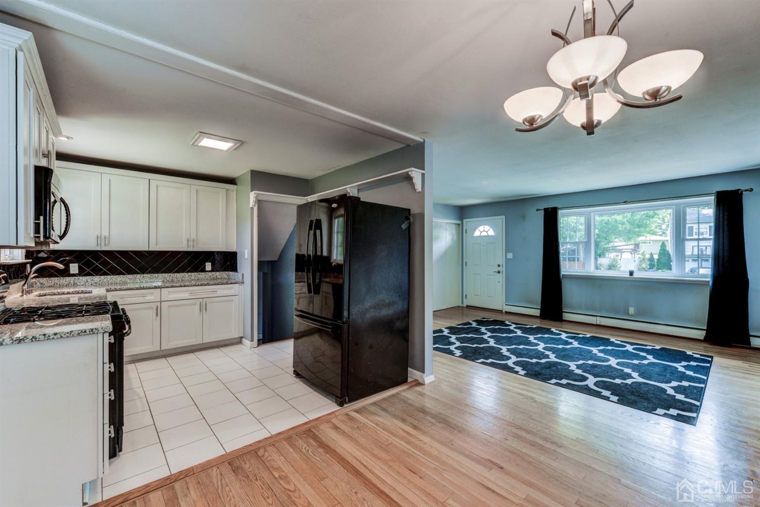37 Finley Road Edison, NJ 08817 - Photo 9 of 29 a kitchen with a refrigerator and a stove top oven