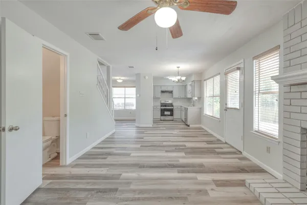 a view of an entryway with wooden floor and a large window
