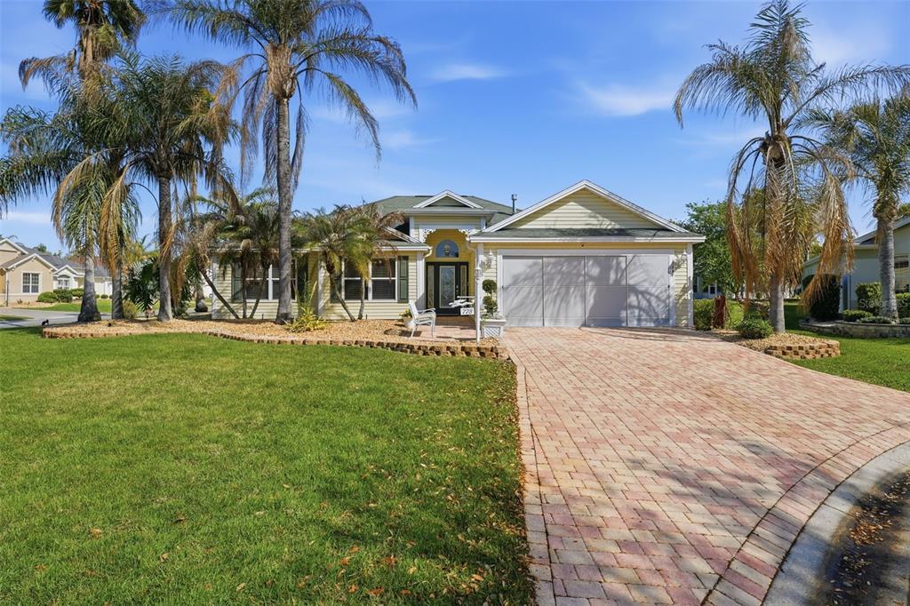 778 Moore Terrace The Villages, FL 32162 - Photo 1 of 1 a front view of a house with a garden