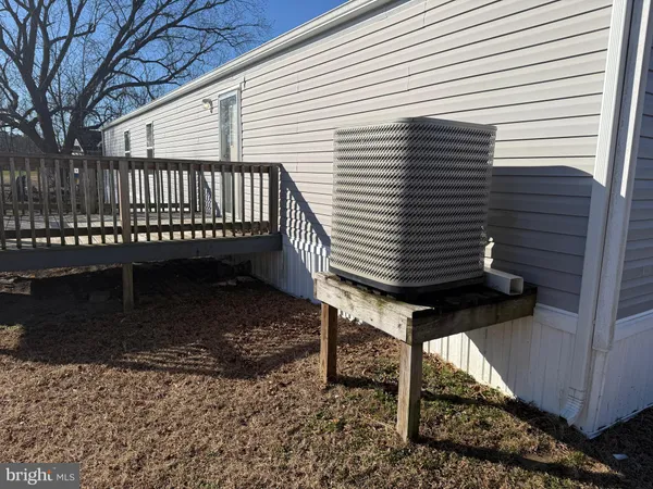 a view of a chairs setting on the roof deck