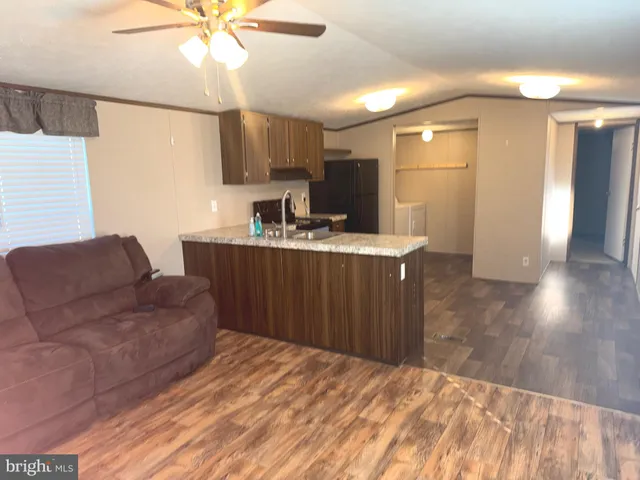 a kitchen with a refrigerator and a sink