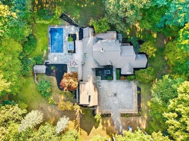 an aerial view of a house with patio