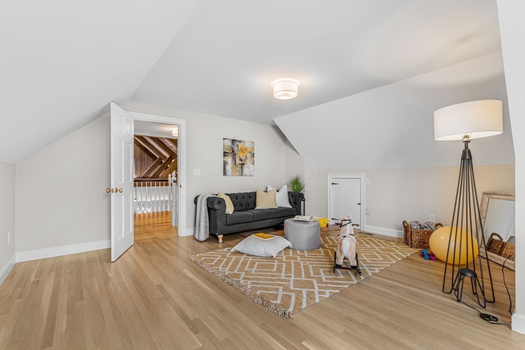 1437-3 Monument Street Concord, MA 01742 - Photo 24 of 41 a living room with furniture and a wooden floor