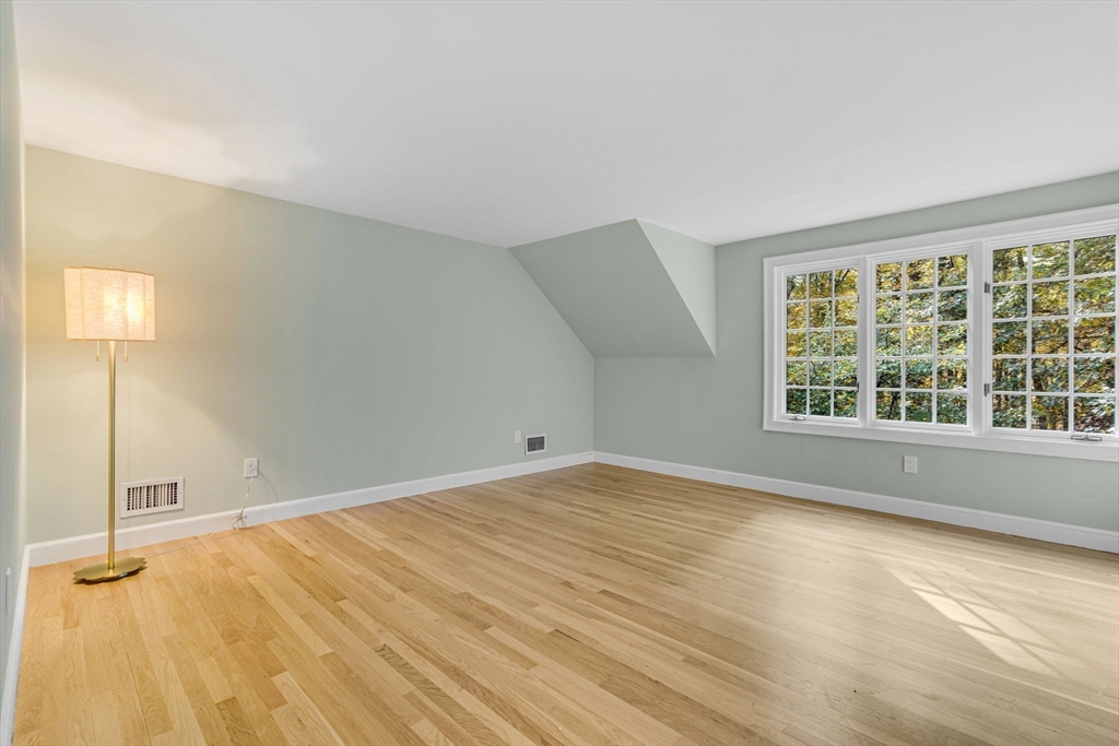 1437-3 Monument Street Concord, MA 01742 - Photo 27 of 41 a view of an empty room with wooden floor and a window