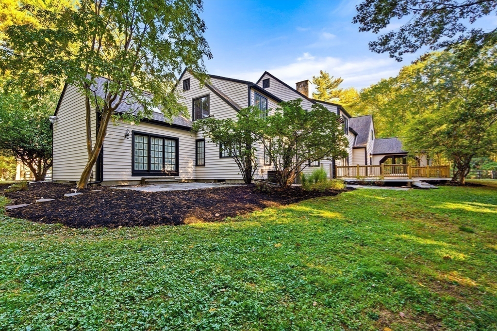 1437-3 Monument Street Concord, MA 01742 - Photo 29 of 41 a front view of a house with a garden