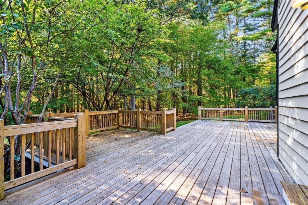 1437-3 Monument Street Concord, MA 01742 - Photo 30 of 41 a view of balcony with deck and wooden floor