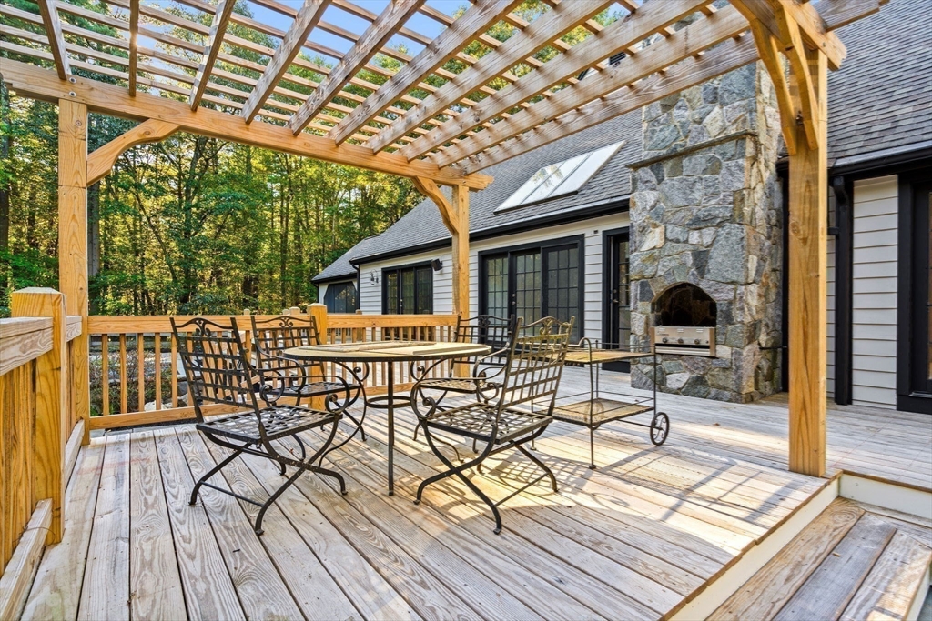 1437-3 Monument Street Concord, MA 01742 - Photo 35 of 41 a view of a chairs and table on the wooden floor