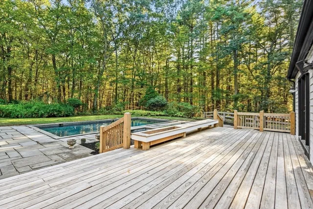 a view of outdoor space with deck and yard