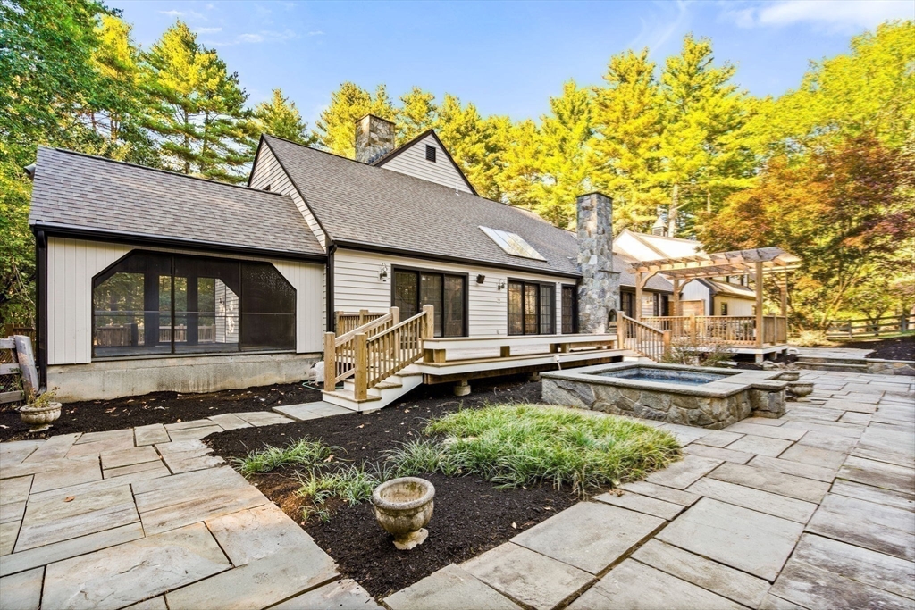 1437-3 Monument Street Concord, MA 01742 - Photo 38 of 41 a front view of a house with garden