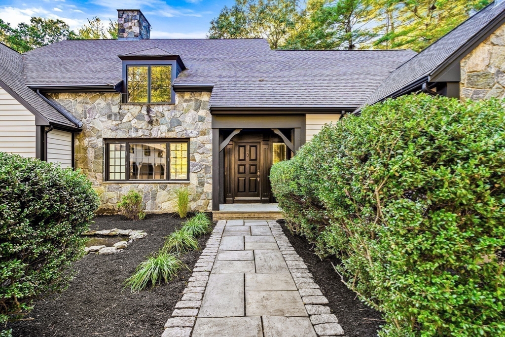 1437-3 Monument Street Concord, MA 01742 - Photo 40 of 41 a front view of a house with a garden