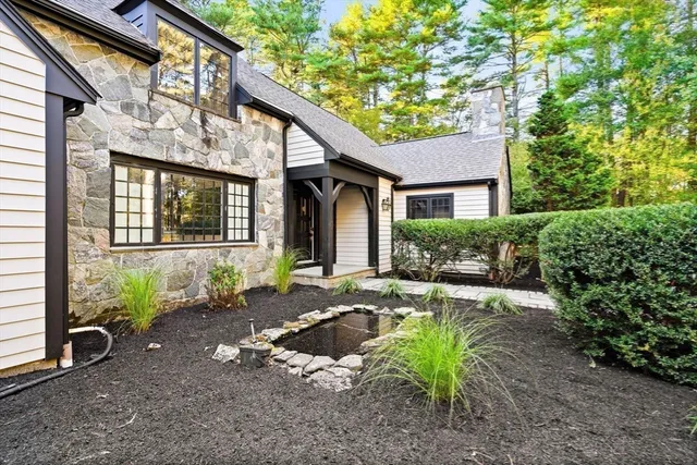 a front view of a house with garden