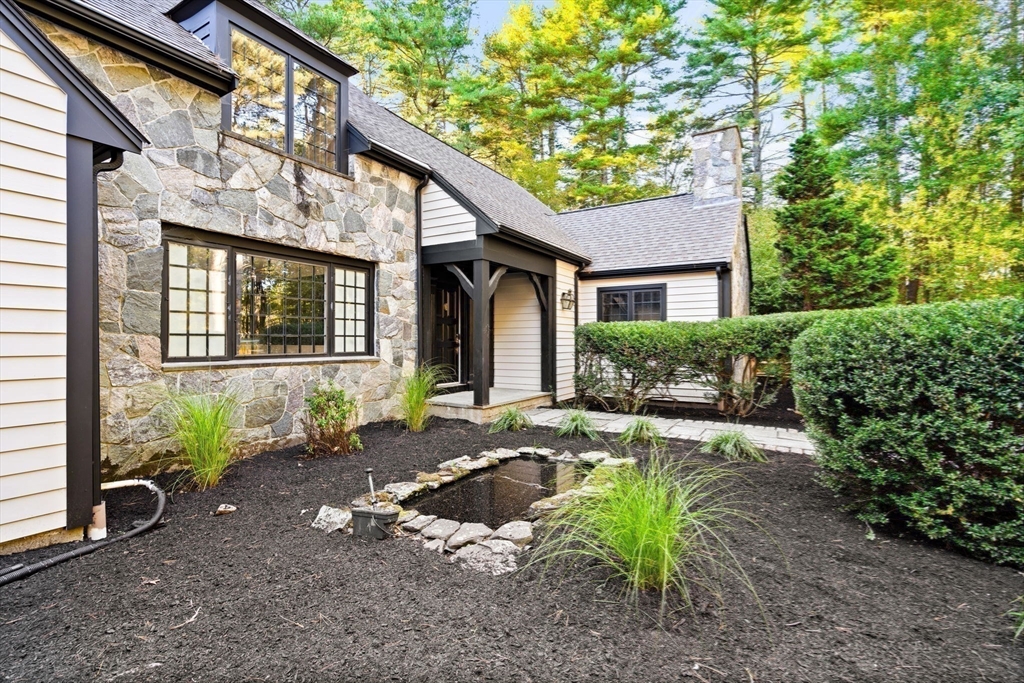 1437-3 Monument Street Concord, MA 01742 - Photo 41 of 41 a front view of a house with garden