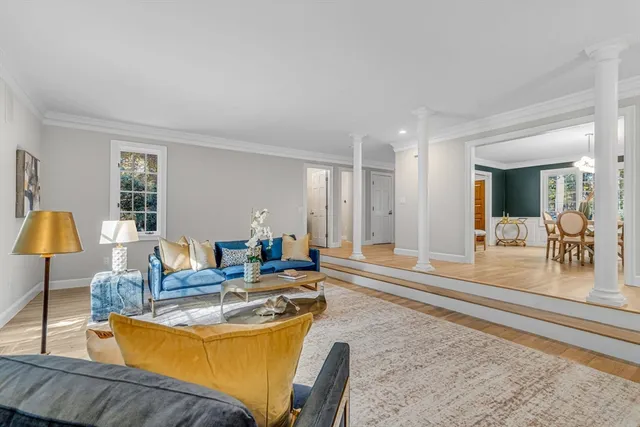 a living room with furniture and a table