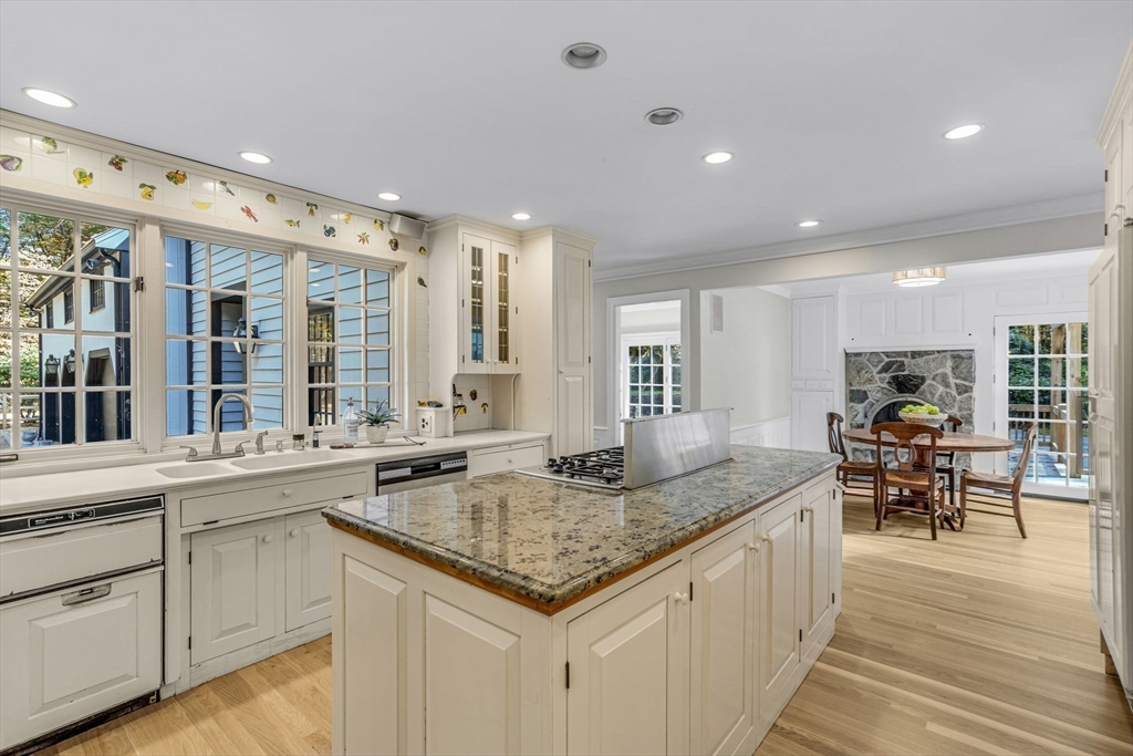 1437-3 Monument Street Concord, MA 01742 - Photo 9 of 41 a kitchen with center island table and chairs