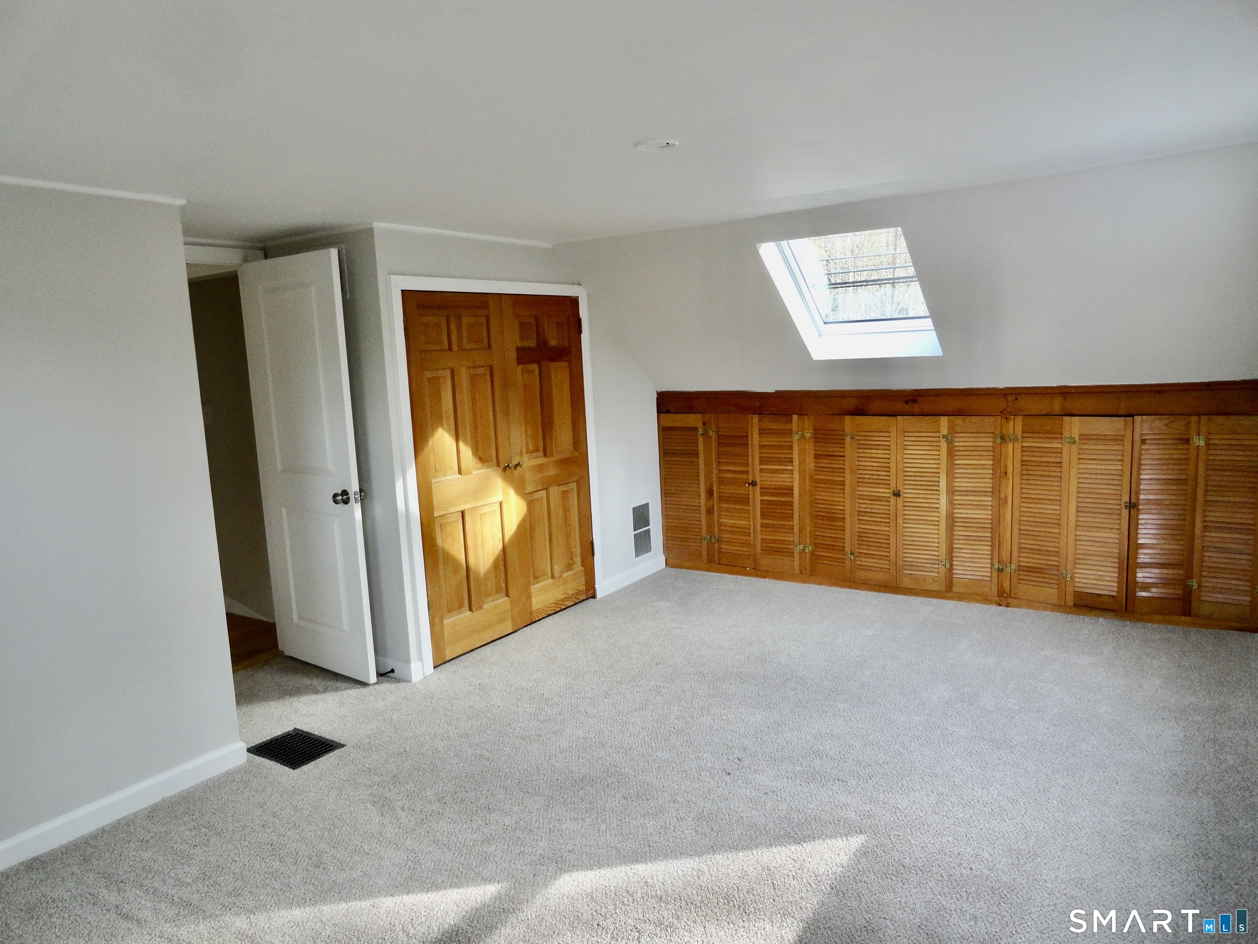 an empty room with sliding door