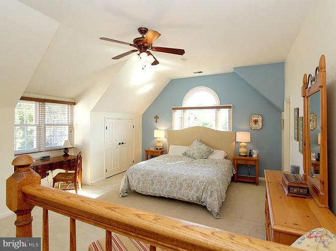 8 Midsummer Court Gaithersburg, MD 20878 - Photo 16 of 30 a bedroom with a bed and wooden floor