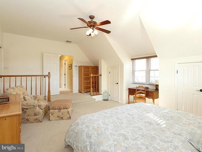 8 Midsummer Court Gaithersburg, MD 20878 - Photo 17 of 30 a bedroom with a bed and a chandelier