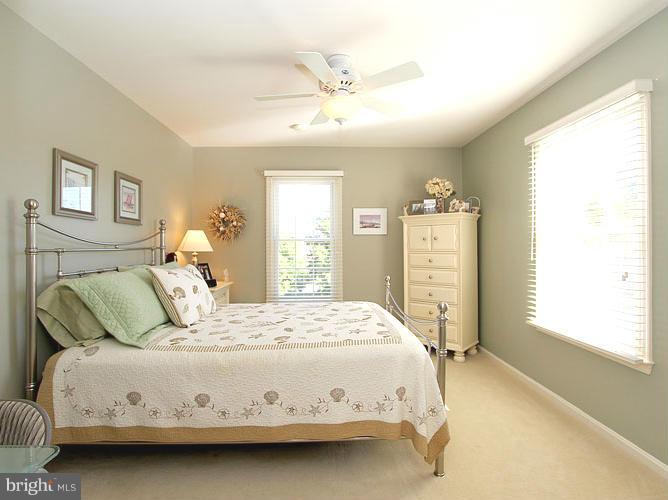 8 Midsummer Court Gaithersburg, MD 20878 - Photo 21 of 30 a bedroom with a bed next to a window and a dresser