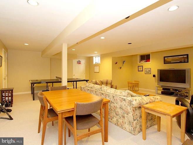 8 Midsummer Court Gaithersburg, MD 20878 - Photo 24 of 30 a dining hall with a stove and a refrigerator with wooden floor