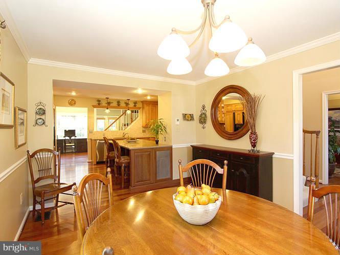 8 Midsummer Court Gaithersburg, MD 20878 - Photo 4 of 30 a view of a dining room with furniture and a chandelier