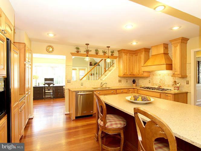 8 Midsummer Court Gaithersburg, MD 20878 - Photo 6 of 30 a kitchen with a stove a refrigerator and a stove top oven